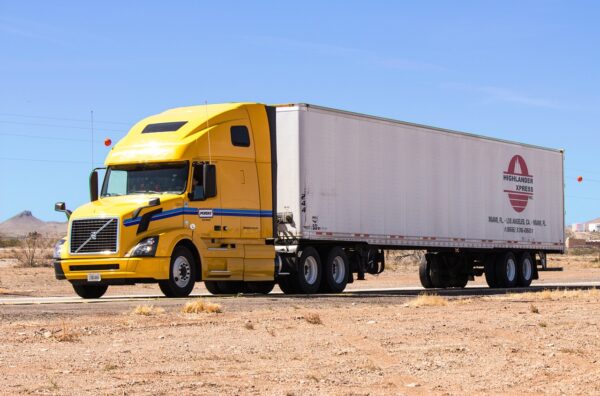 A large penske truck traveling on the road